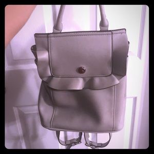 Grey imitation leather back pack/ purse